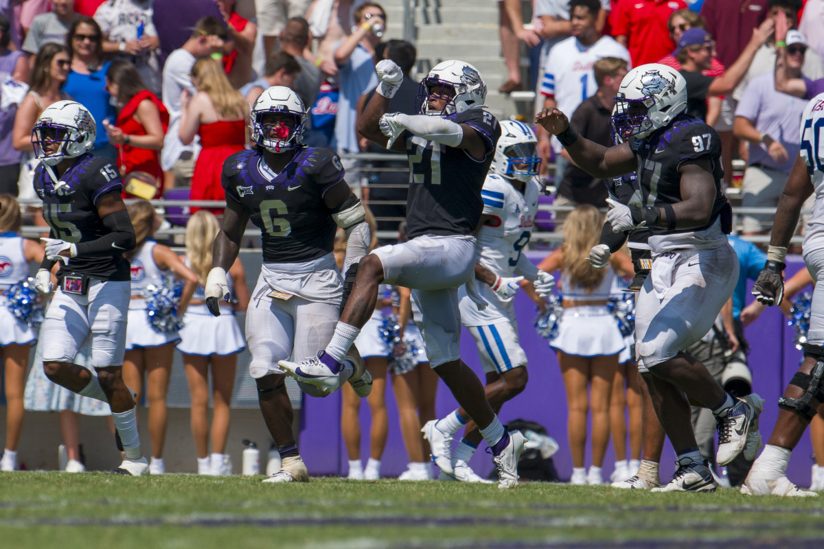 Sep 23, 2023; Fort Worth, Texas, USA; TCU Horned Frogs safety Bud Clark (21) and the Horned Frog defense celebrate after Clark intercepts an SMU Mustangs pass during the second half at Amon G. Carter Stadium. Mandatory Credit: Jerome Miron-USA TODAY Sports